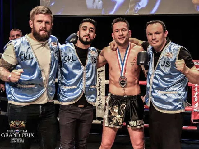 Shin Kick coaches and fighters at a Muay Thai event